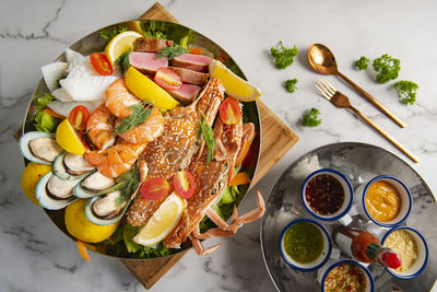 High angle view of fruits in plate on table