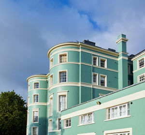 Low angle view of building against blue sky