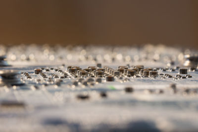Surface level of water in row against sky