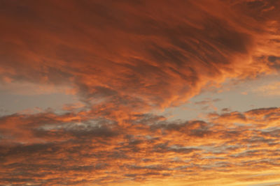 Low angle view of dramatic sky during sunset