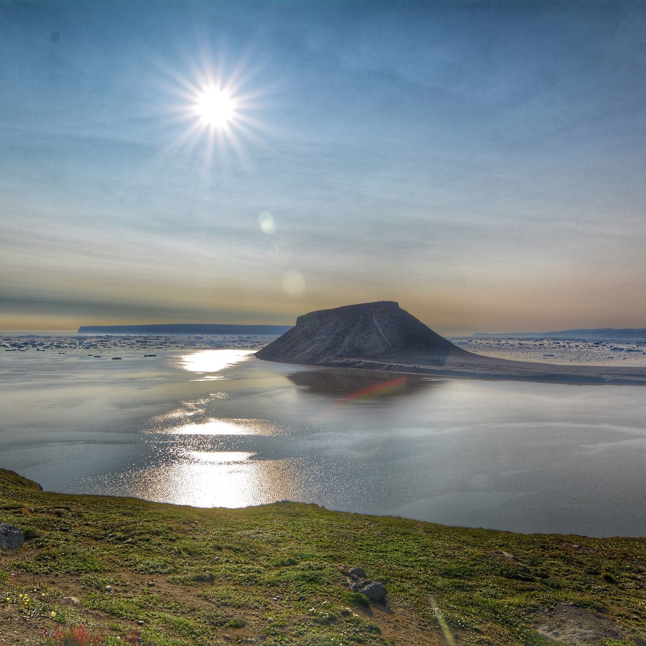 water, tranquil scene, sun, scenics, tranquility, beauty in nature, sea, sky, reflection, sunbeam, horizon over water, sunlight, nature, beach, shore, lens flare, idyllic, grass, cloud - sky, non-urban scene