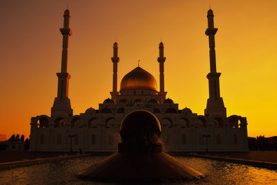 View of historic building against sky during sunset