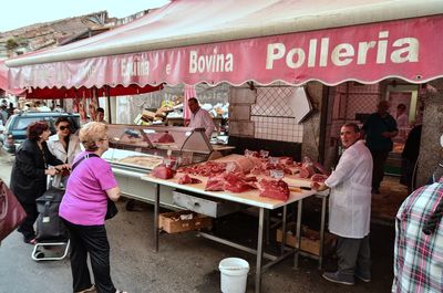 People at market stall