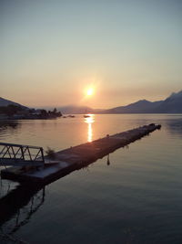 Scenic view of lake against sky during sunset