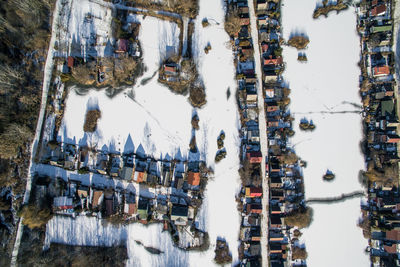 Directly above shot of houses on snow covered field