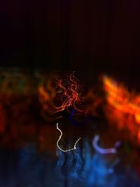 Close-up of illuminated fire in water