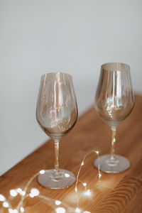 Close-up of wine glasses on table