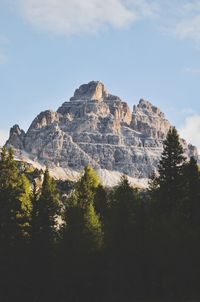 Low angle view of rocky mountains against sky