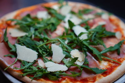 Close-up of pizza served in plate