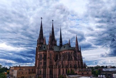 Low angle view of cathedral against cloudy sky