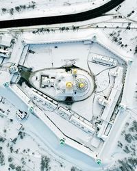 Aerial view of church in city during winter