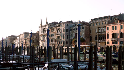 Buildings in city against clear sky