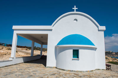 View of temple against clear blue sky