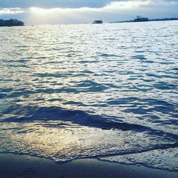 Scenic view of sea against cloudy sky