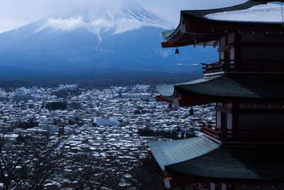 Buildings in city during winter
