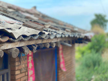 Close-up of multi colored roof tiles against building