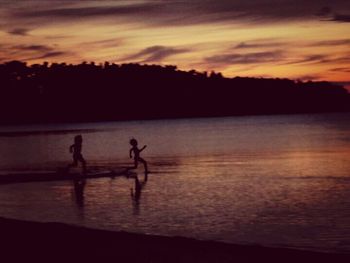 Silhouette of people at sunset