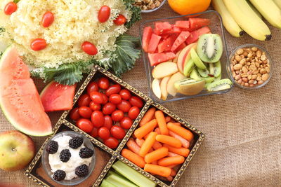 High angle view of various fruits with vegetables on table