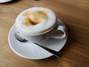 Close-up of cappuccino on table