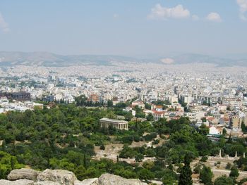 Cityscape with mountain range in background