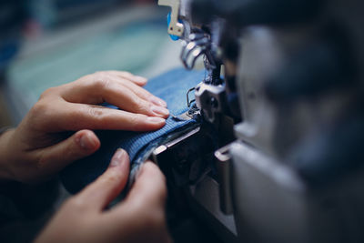 Close-up of hand holding fabric