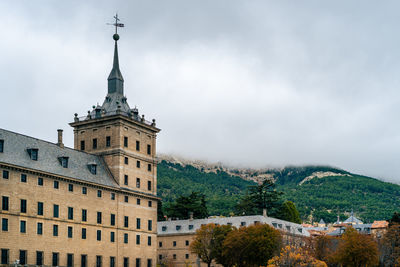 Buildings in city against sky