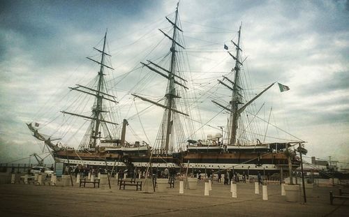 View of harbor against cloudy sky