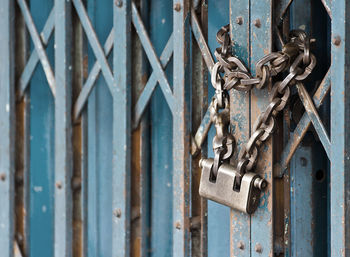 Close-up of padlock on metal gate