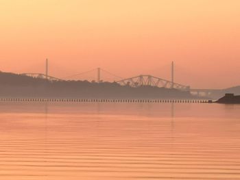 Scenic view of suspension bridge against sky during sunset