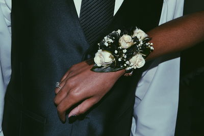 Close-up of woman wearing corsage