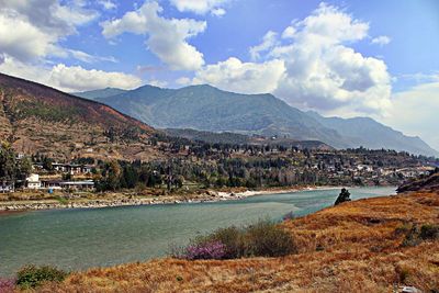 Scenic view of landscape and mountains against sky