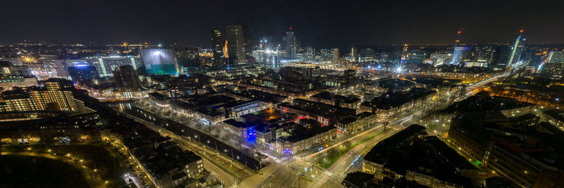 High angle view of city lit up at night