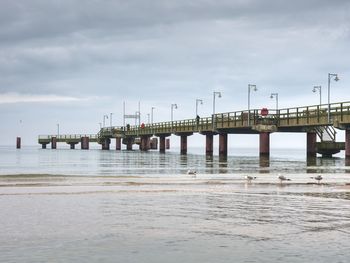 Pier over sea against sky