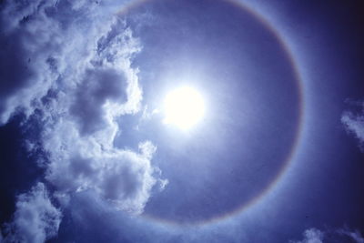 Low angle view of sun in sky