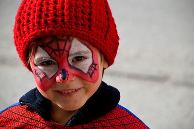 Close-up portrait of girl in superhero costume at carnival