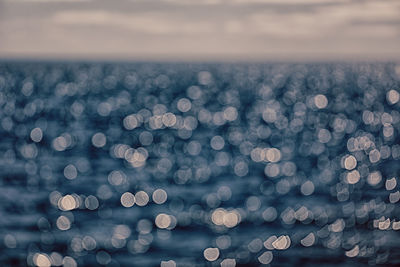 Defocused image of sea against sky