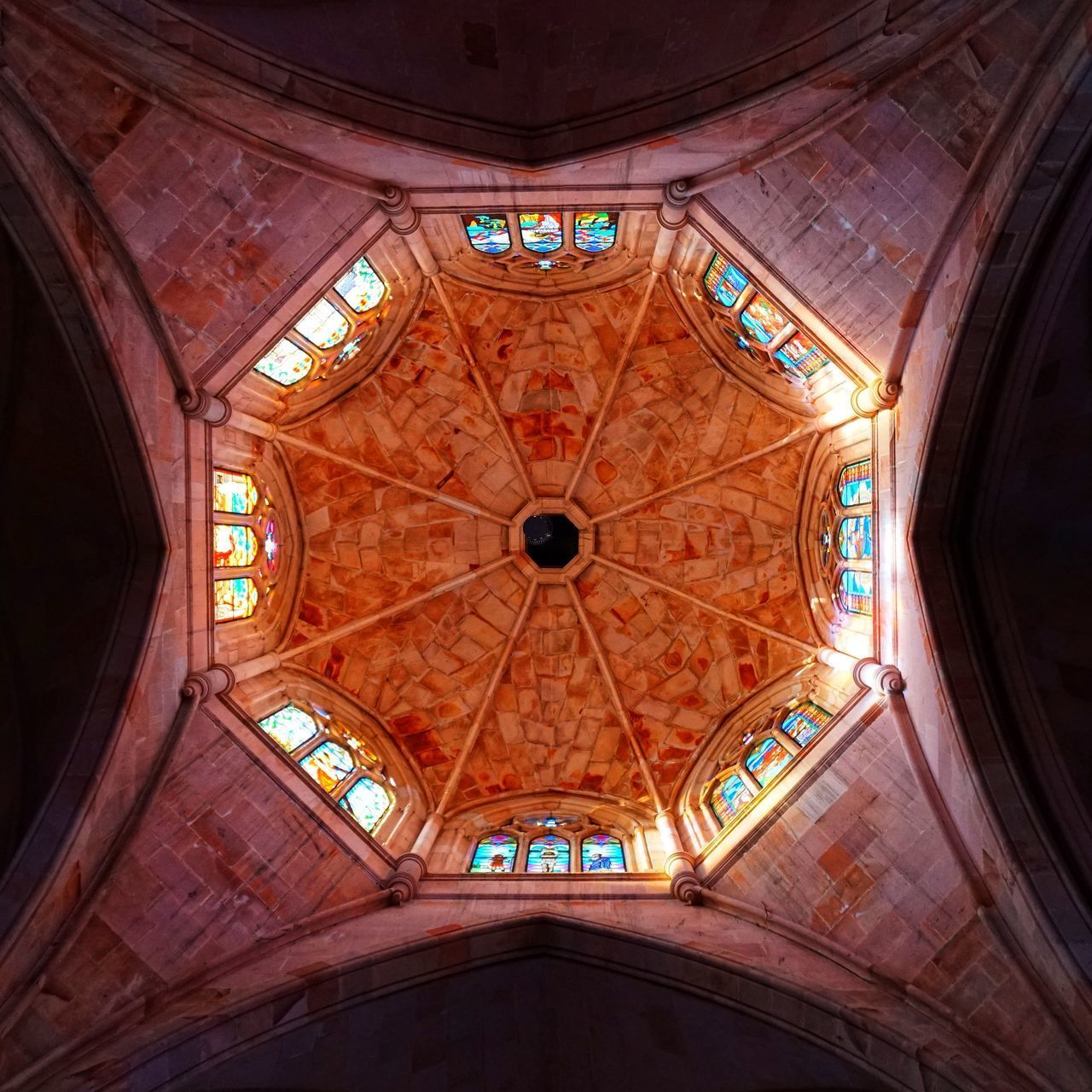 LOW ANGLE VIEW OF GLASS CEILING OF BUILDING