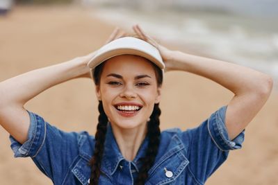 Portrait of young woman standing outdoors