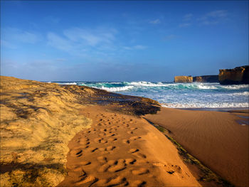 Scenic view of beach against sky