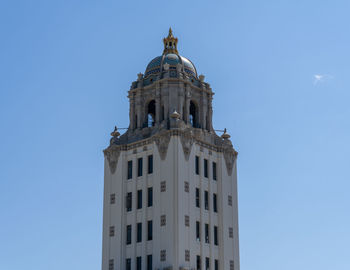 Low angle view of building against clear blue sky