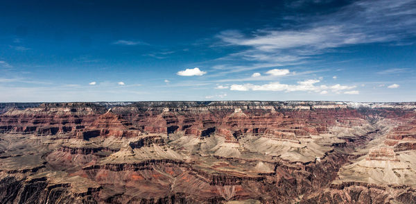 Scenic view of grand canyon against blue sky