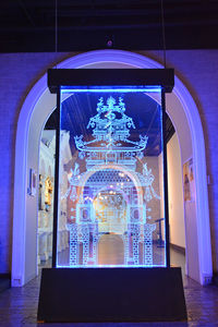 Low angle view of illuminated chandelier in building