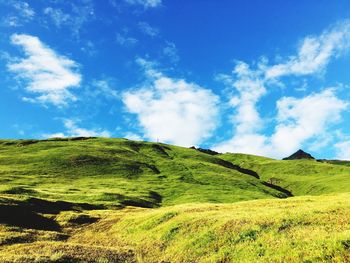 Scenic view of landscape against cloudy sky