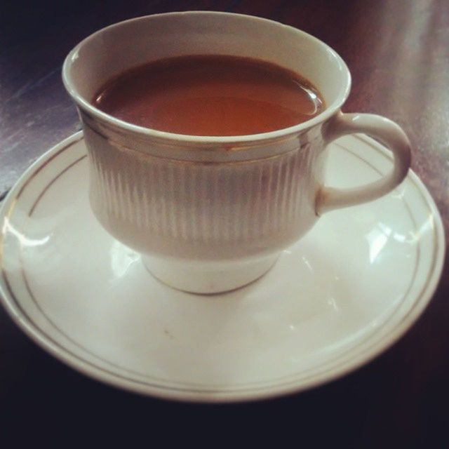 indoors, food and drink, coffee cup, drink, refreshment, table, still life, saucer, freshness, coffee - drink, cup, close-up, coffee, high angle view, tea cup, no people, spoon, plate, frothy drink, tea