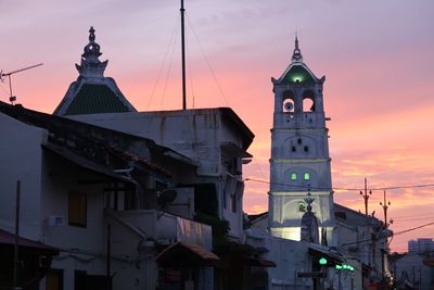 Low angle view of clock tower against sky