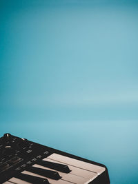 High section of building against clear blue sky