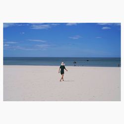 Full length of man on beach against sky