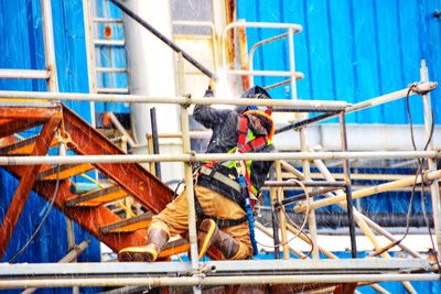 Low angle view of a welder worker