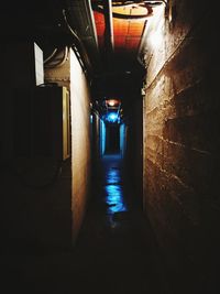 Empty walkway in illuminated building