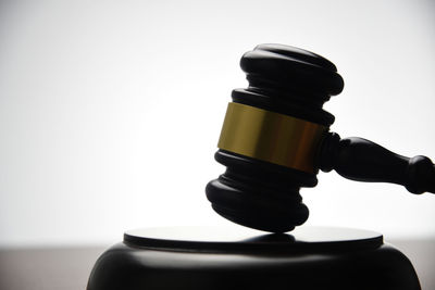 Close-up of stack on table against white background